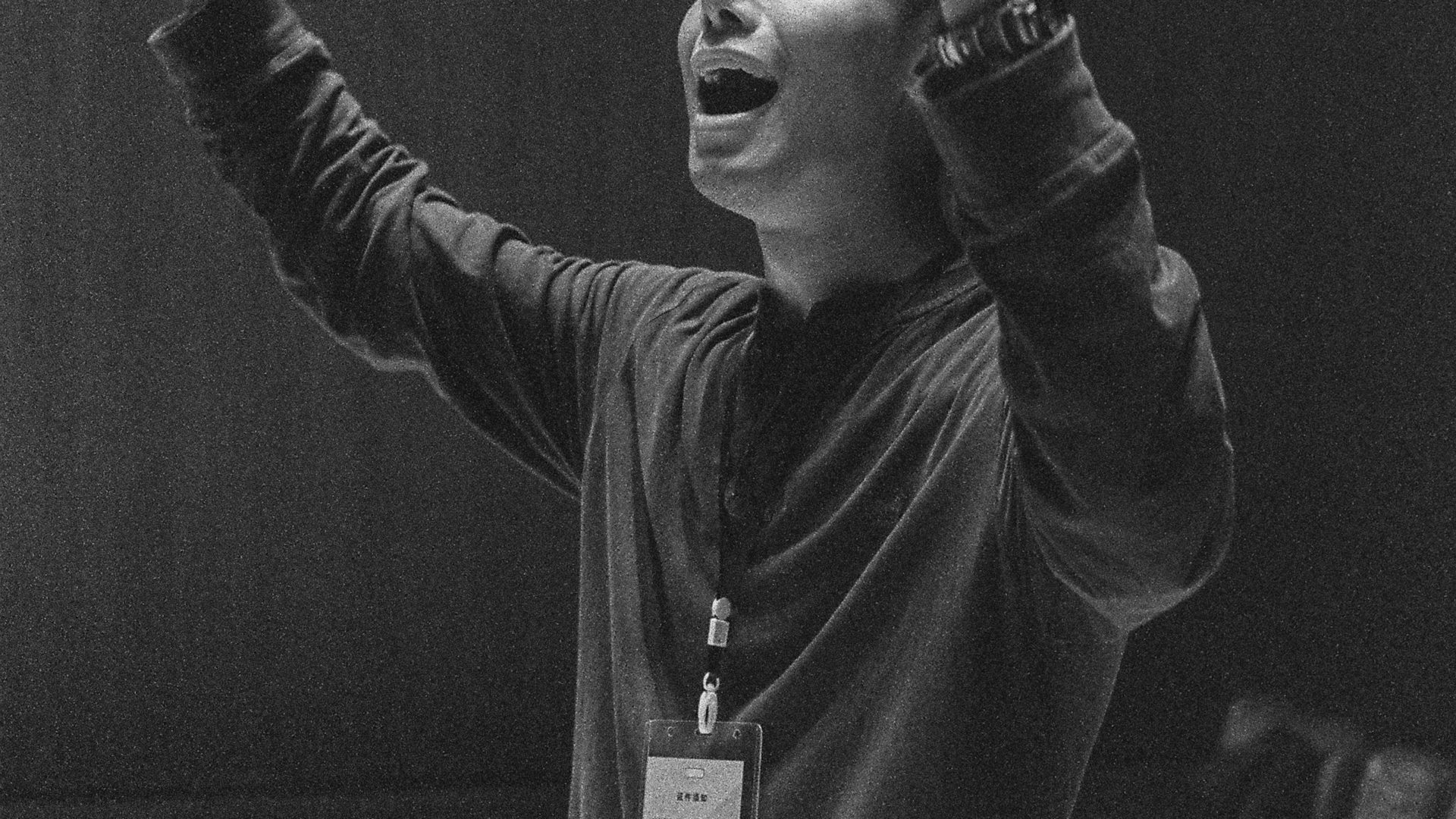 Musical conductor raising hands